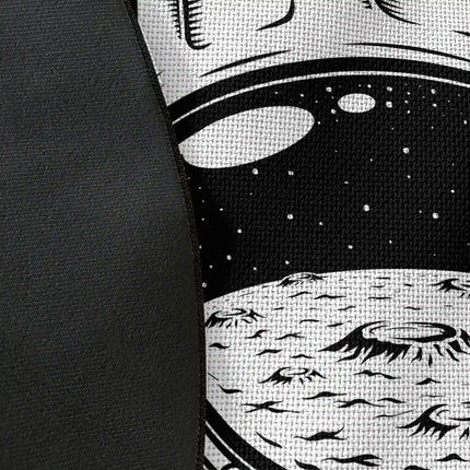 Close up of woven polyester material on astronaut academy graphic round rug with Jet Black edge finish showing astronaut helmet and typography print detail
