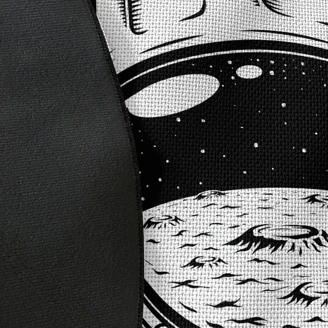 Close up of woven polyester material on astronaut academy graphic round rug with Jet Black edge finish showing astronaut helmet and typography print detail