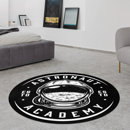 Astronaut academy graphic round rug with monochrome astronaut helmet artwork and academy style typography styled in a modern bedroom with Jet Black edge finish