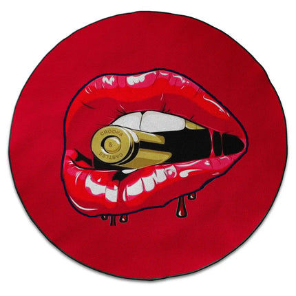 Red graphic round rug with lips and bullet design shown from above on white background with Jet Black edge