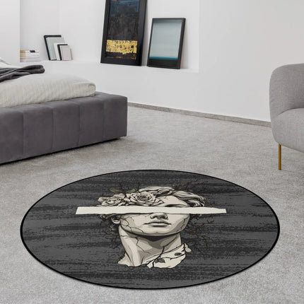 Blind vision graphic round rug with fractured marble statue artwork, floral crown details and black censor bar styled in a modern bedroom with Jet Black edge finish