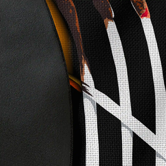 Close up of woven polyester material on burnt matches graphic round rug with Jet Black edge finish showing print texture