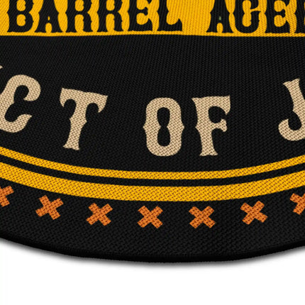 Close up of Caribbean rum round rug Jet Black edge showing woven polyester detail