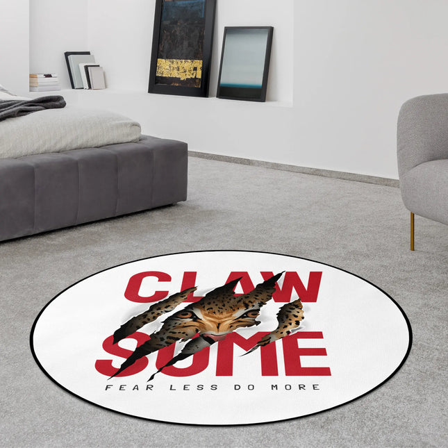 Claw some graphic round rug with claw mark design, predator eye graphic and bold typography styled in a modern bedroom with Jet Black edge finish