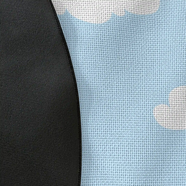 Close up of woven polyester material on cloud nine graphic round rug with Jet Black edge finish showing soft cloud print detail
