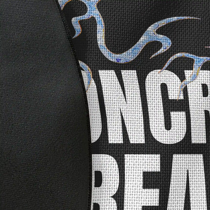 Close up of woven polyester material on concrete dreams graphic round rug with Jet Black edge showing detailed typography print texture and monochrome contrast