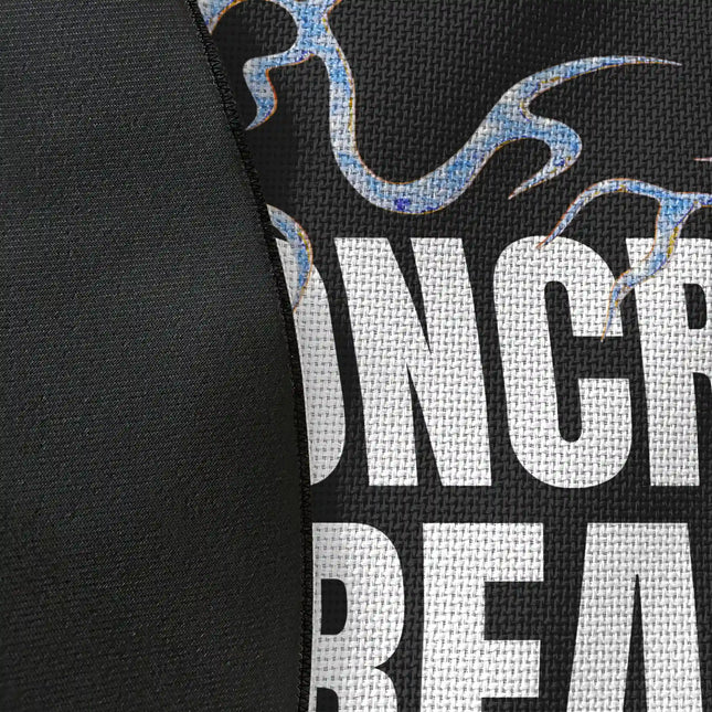 Close up of woven polyester material on concrete dreams graphic round rug with Jet Black edge showing detailed typography print texture and monochrome contrast