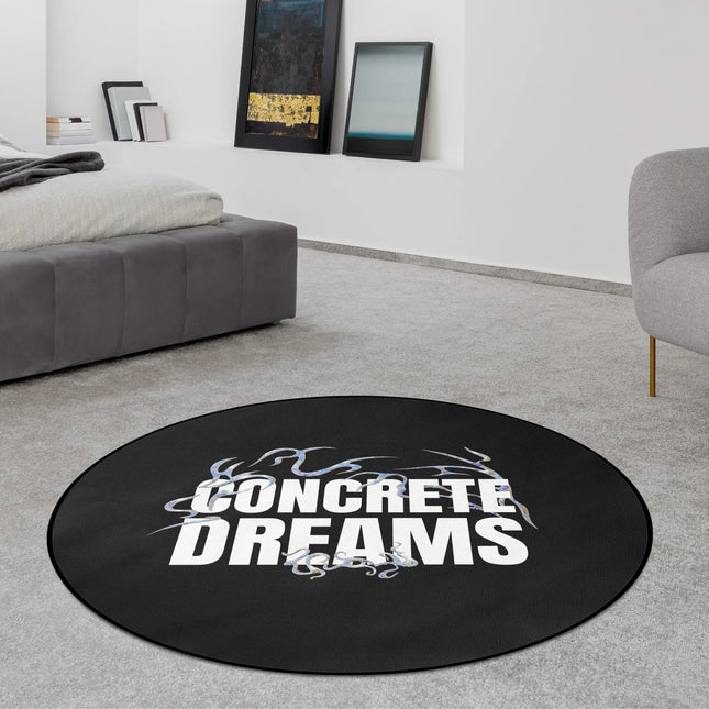 Black concrete dreams graphic round rug with oversized monochrome typography and smoke-style detailing styled in a modern bedroom with Jet Black edge finish