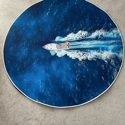 A round area rug featuring a printed design of a white speedboat cutting through deep blue water, shown on a beige carpeted floor near a wooden door.