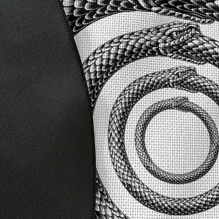 Close up of woven polyester material on Endless Coil graphic round rug with Jet Black edge showing serpent spiral artwork and print texture