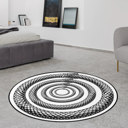 Endless Coil graphic round rug with monochrome serpent spiral artwork styled in a modern bedroom with Jet Black edge finish