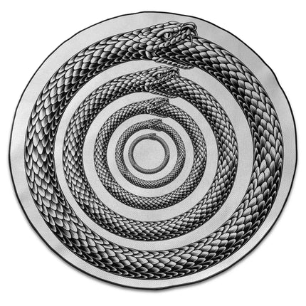 Endless Coil graphic round rug with Jet Black edge finish shown from above on white background