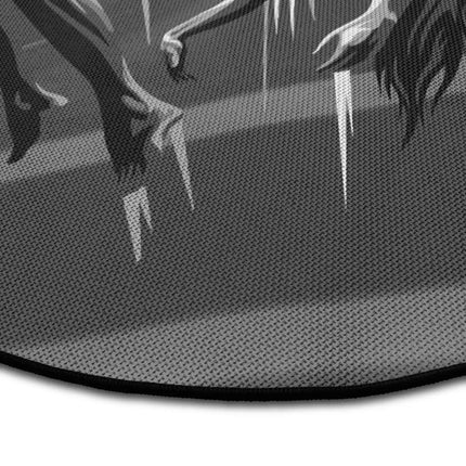 Close up of false freedom graphic round rug with puppet string artwork showing Jet Black edge and woven polyester texture