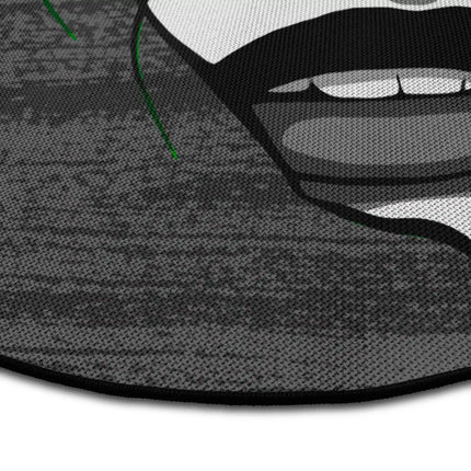 Close up of fragmented soul graphic round rug with distorted face artwork showing Jet Black edge and woven polyester texture