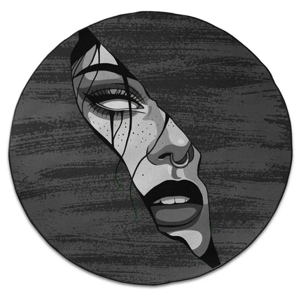 Fragmented soul graphic round rug with distorted monochrome face artwork and Jet Black edge finish shown from above on white background