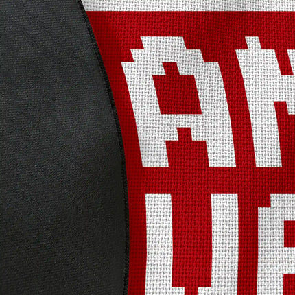 Close up of woven polyester material on game over graphic round rug with Jet Black edge finish showing pixel text print detail
