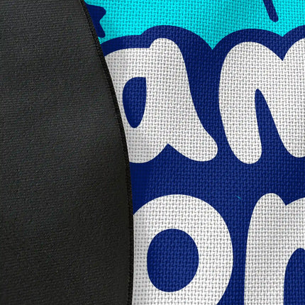 Close up of woven polyester material on game zone graphic round rug with Jet Black edge finish showing blue and white typography print detail
