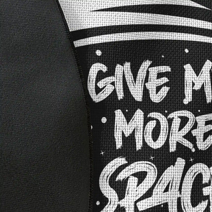 Close up of Give Me More Space graphic round rug Jet Black edge showing woven polyester material and astronaut artwork detail