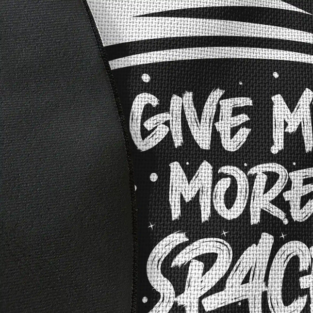 Close up of Give Me More Space graphic round rug Jet Black edge showing woven polyester material and astronaut artwork detail