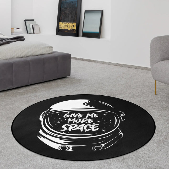 Give Me More Space graphic round rug with astronaut artwork styled in a modern bedroom with Jet Black edge finish