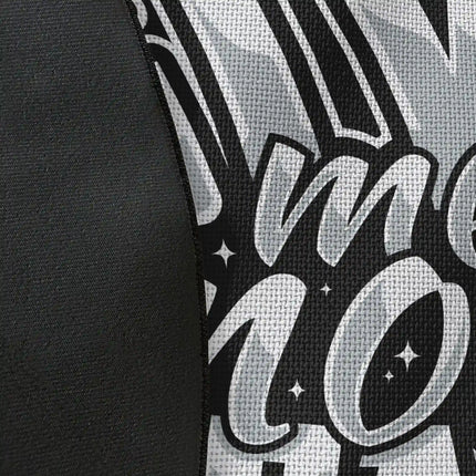 Close up of woven polyester material on typography graphic round rug with “Give Me More Space” text showing detailed print texture and contrast with Jet Black edge