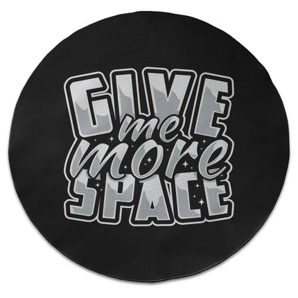 Black typography graphic round rug with “Give Me More Space” text shown from above on white background with Jet Black edge