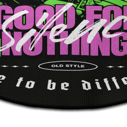 Close up of black streetwear graphic round rug with ski mask design showing Jet Black edge and woven polyester texture