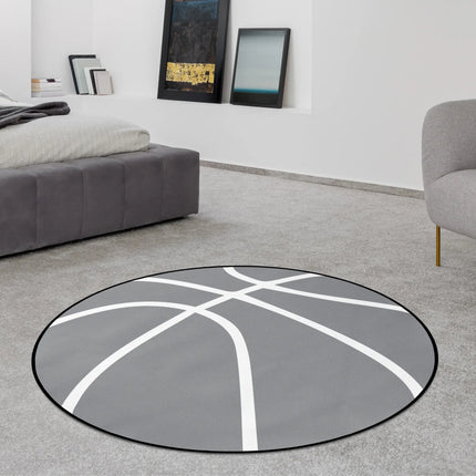 Grey basketball round rug with white line graphic styled in a modern bedroom with Jet Black edge finish