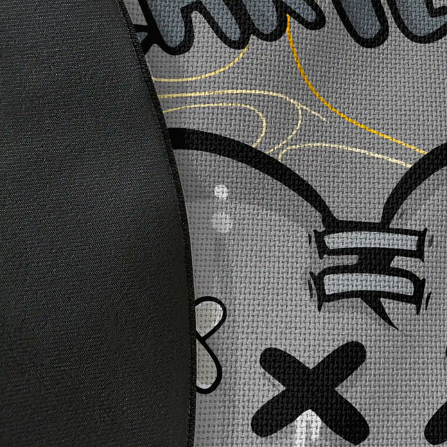 Close up of woven polyester material on Heartless graphic round rug with Jet Black edge showing stabbed heart artwork and print texture