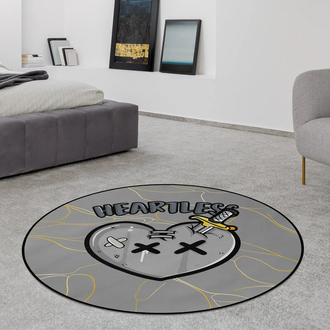 Heartless graphic round rug with stabbed heart artwork styled in a modern bedroom with Jet Black edge finish