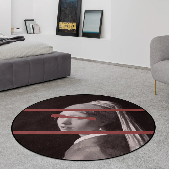 Hidden Gaze graphic round rug with distorted portrait artwork styled in a modern bedroom with Jet Black edge finish