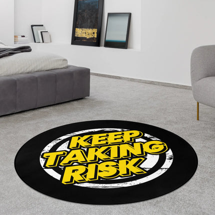 Black and yellow Keep Taking Risk graphic round rug styled in a modern bedroom with Jet Black edge finish