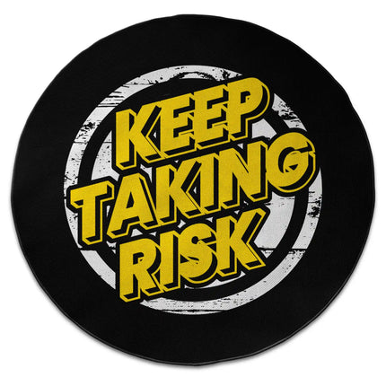Keep Taking Risk graphic round rug with Jet Black edge finish shown from above on white background