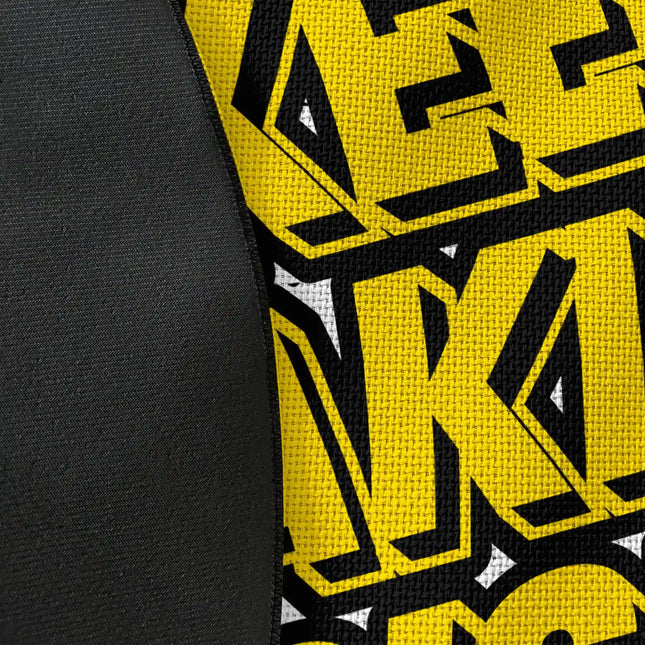 Close up of woven polyester material on Keep Taking Risk graphic round rug showing print texture with jet black edge finish