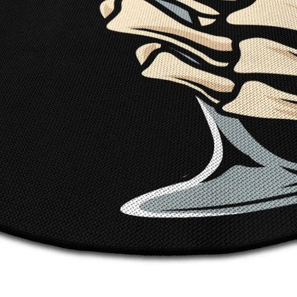 Close up of last sip round rug Jet Black edge showing woven polyester detail