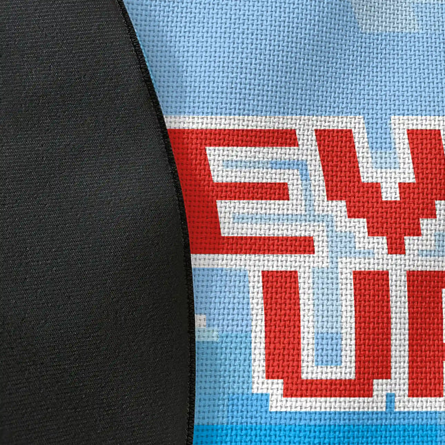 Close up of woven polyester material on level up graphic round rug with Jet Black edge finish showing pixel print texture