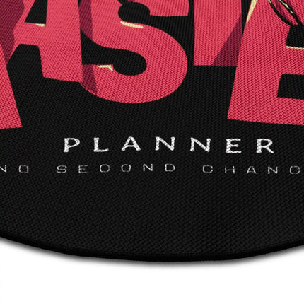 Close up of master planner graphic round rug Jet Black edge showing woven polyester detail
