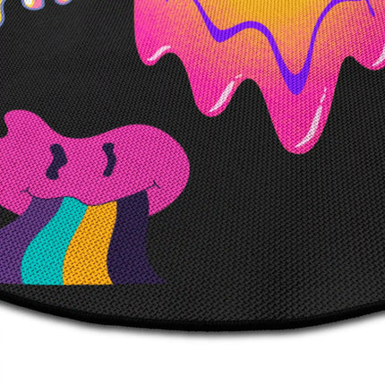 Close up of Melted Mood graphic round rug with colourful smiley artwork showing Jet Black edge and woven polyester texture