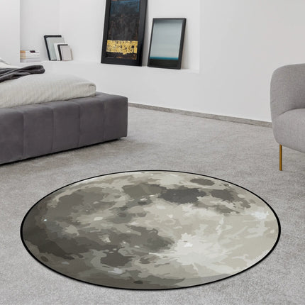 Midnight moon graphic round rug with detailed lunar surface artwork and realistic crater textures styled in a modern bedroom with Jet Black edge finish