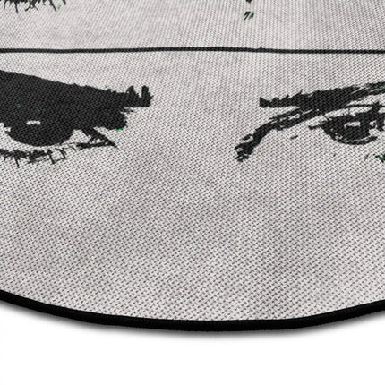 Close up of mind reader graphic round rug with fragmented eye artwork showing Jet Black edge and woven polyester texture
