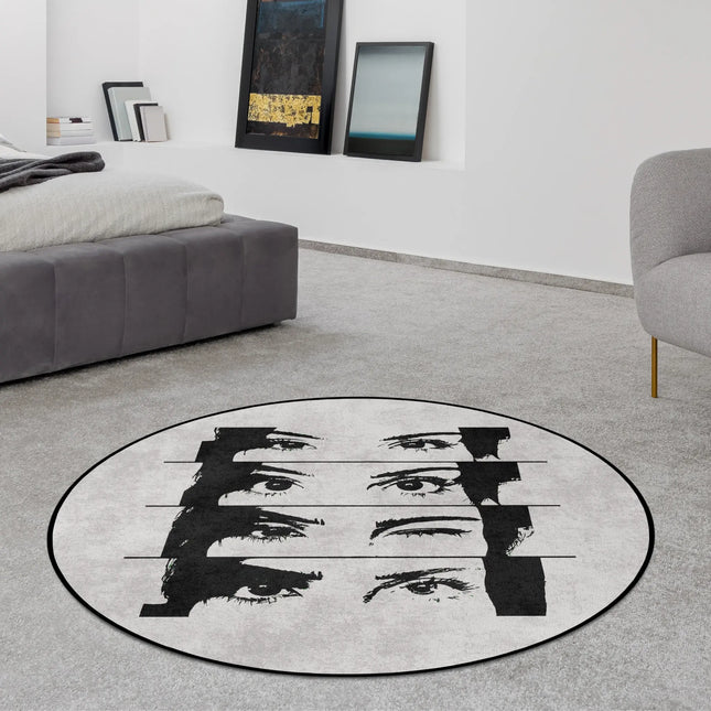 Mind reader graphic round rug with fragmented eye artwork styled in a modern bedroom with Jet Black edge finish