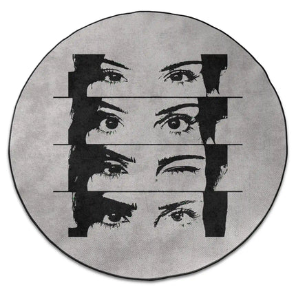 Mind reader graphic round rug with fragmented eye artwork and Jet Black edge finish shown from above on white background