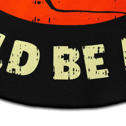 Close up of music graphic round rug Jet Black edge showing woven polyester detail