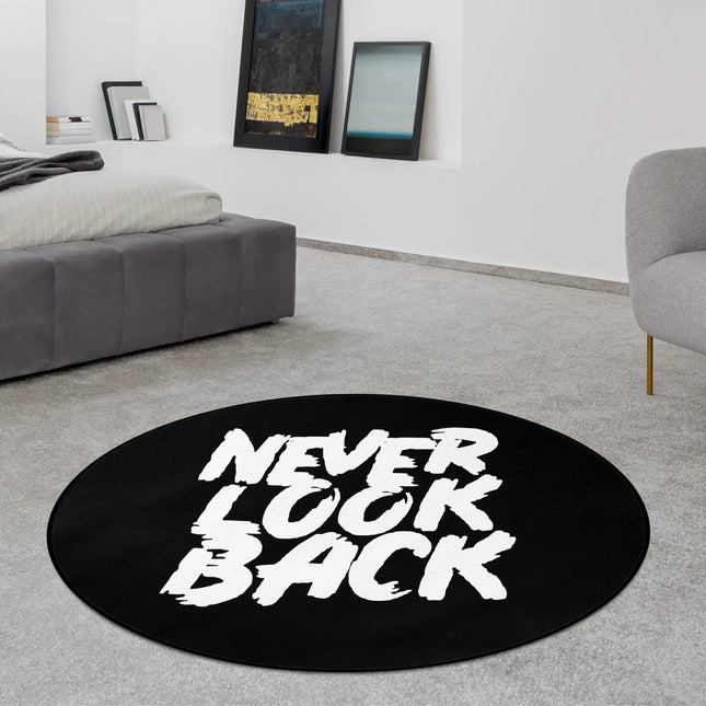 Black never look back graphic round rug styled in a modern bedroom with Jet Black edge finish
