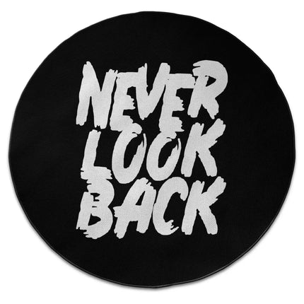 Never look back graphic round rug with Jet Black edge finish shown from above on white background