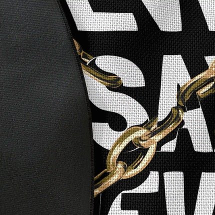 Close up of woven polyester material on never say never graphic round rug with Jet Black edge finish showing chain and typography print detail