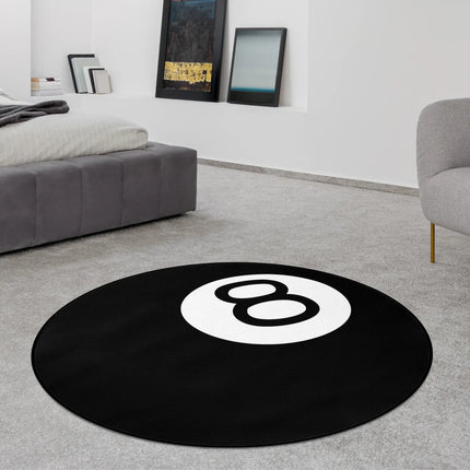 Black number 8 ball graphic round rug with white circle design styled in a modern bedroom with Jet Black edge finish
