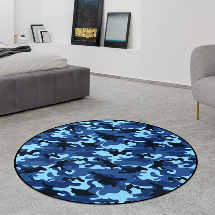 Ocean camo graphic round rug with layered blue camouflage pattern styled in a modern bedroom with Jet Black edge finish