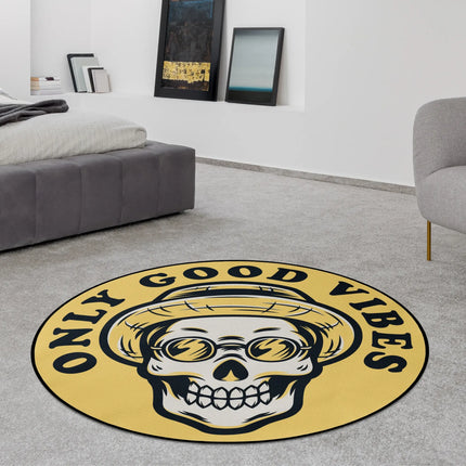 Yellow only good vibes graphic round rug with skull wearing straw hat and bold text styled in a modern bedroom with Jet Black edge finish