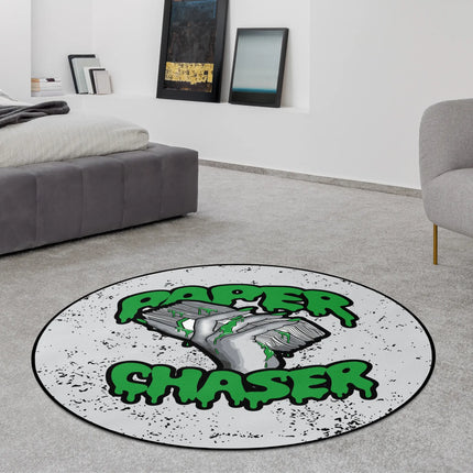 Paper Chaser graphic round rug with stacked cash artwork styled in a modern bedroom with Jet Black edge finish